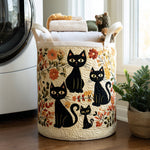 Quilted storage basket with black cats and flowers design, filled with towels next to a washing machine