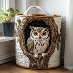 Quilted storage basket with an owl in a tree hollow design, white handles
