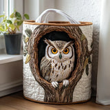 Quilted storage basket with an owl in a tree hollow design, white handles