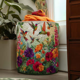 Quilted storage basket decorated with hummingbirds flying among colorful garden flowers