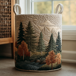 Quilted storage basket with embroidered mountain and forest landscape design