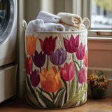 Quilted storage basket decorated with colorful blooming tulips, filled with towels