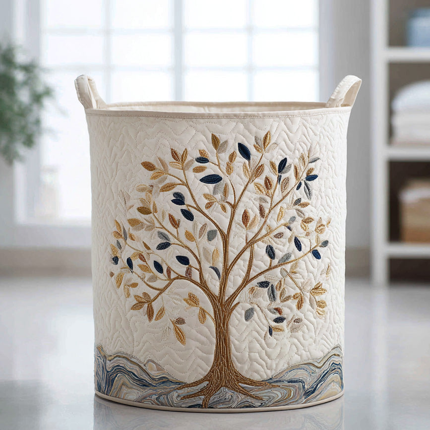 Cream quilted storage basket with an embroidered tree in full bloom in gold, beige and navy tones