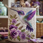 Quilted storage basket with a hummingbird and purple flowers design